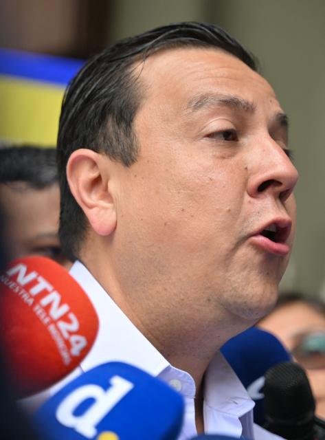 Venezuelan political activist Javier Tarazona speaks to the media outside the Justice Palace in Caracas on March 24, 2026. A Venezuelan court refused to grant an amnesty to renowned activist Javier Tarazona on March 24, 2026, who was released on parole on February 1 after four years incarcerated for "terrorism" and "treason." (Photo by Juan BARRETO / AFP)