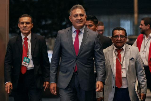 Peru's presidential candidate Carlos Jaico, for the Peru Moderno party, arrives at the Lima Convention Center ahead of the second round of debates on tackling crime and corruption in Lima on March 24, 2026. Peru will hold presidential elections on April 12. (Photo by Connie FRANCE / AFP)