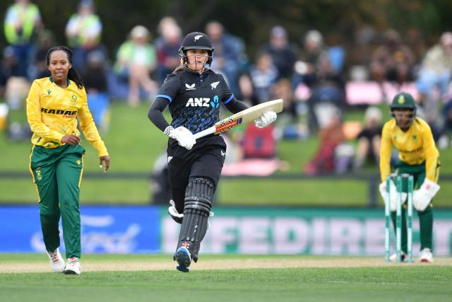 New Zealand's Amelia Kerr (C) runs between the wickets during the fifth Twenty20 international women's cricket match between New Zealand and South Africa at Hagley Oval in Christchurch on March 25, 2026. (Photo by Sanka Vidanagama / AFP)