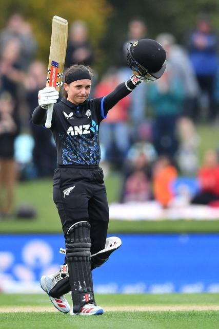 New Zealand's Amelia Kerr celebrates her century during the fifth Twenty20 international women's cricket match between New Zealand and South Africa at Hagley Oval in Christchurch on March 25, 2026. (Photo by Sanka Vidanagama / AFP)