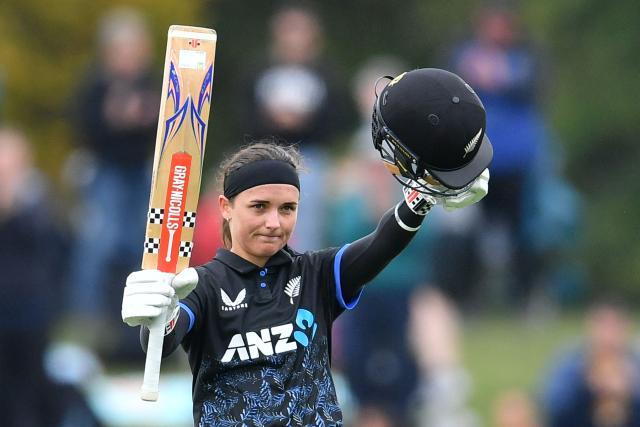 New Zealand's Amelia Kerr celebrates her century during the fifth Twenty20 international women's cricket match between New Zealand and South Africa at Hagley Oval in Christchurch on March 25, 2026. (Photo by Sanka Vidanagama / AFP)