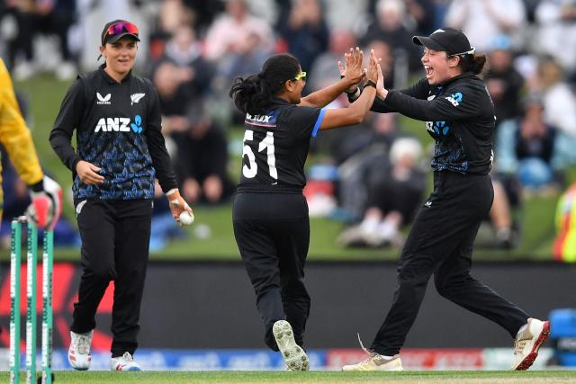 New Zealand's Nensi Patel (C), Georgia Plimmer (R) and Amelia Kerr celebrate the wicket of South Africa's Sune Luus during the fifth Twenty20 international women's cricket match between New Zealand and South Africa at Hagley Oval in Christchurch on March 25, 2026. (Photo by Sanka Vidanagama / AFP)