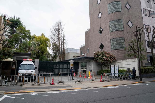 An entrance to the Chinese embassy is seen in Tokyo on March 25, 2026. A man was apprehended in Tokyo March 24 after he trespassed onto the grounds of the Chinese embassy in Tokyo. (Photo by Kazuhiro NOGI / AFP)