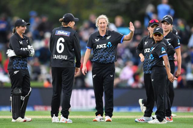 New Zealand's Sophie Devine (C) celebrates with teammates after taking the wicket of South Africa's Karabo Meso during the fifth Twenty20 international women's cricket match between New Zealand and South Africa at Hagley Oval in Christchurch on March 25, 2026. (Photo by Sanka Vidanagama / AFP)