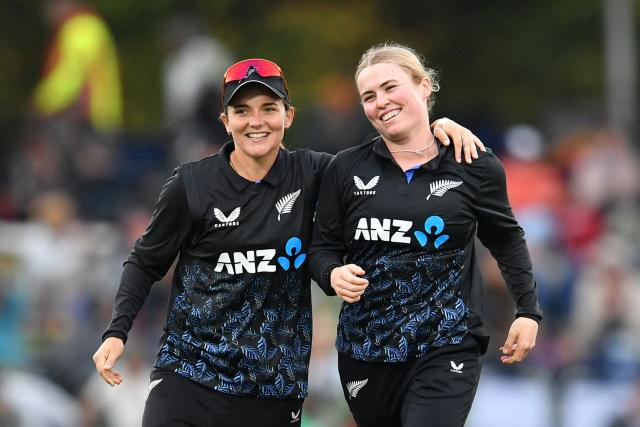 New Zealand's Flora Devonshire (R) celebrates with teammate Amelia Kerr after taking the wicket of South Africa's Kayla Reyneke during the fifth Twenty20 international women's cricket match between New Zealand and South Africa at Hagley Oval in Christchurch on March 25, 2026. (Photo by Sanka Vidanagama / AFP)