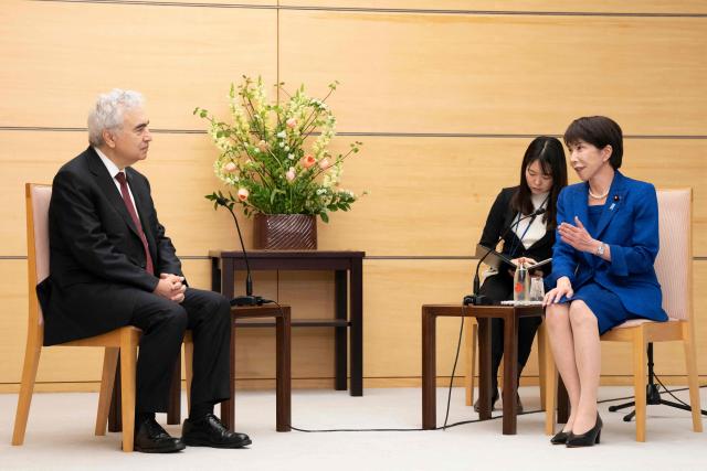 Japan's Prime Minister Sanae Takaichi (R) speaks during a meeting with Executive Director of the International Energy Agency (IEA) Fatih Birol (L) at the Prime Minister's Office in Tokyo on March 25, 2026. (Photo by Yuichi YAMAZAKI / POOL / AFP)