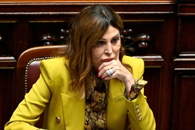 (FILES) Italy's Minister of Tourism, Daniela Santanche seats at the Italian Parliament prior a speech by Britain's King Charles III as part of a State visit in Italy on April 9, 2025. Italian Prime Minister Giorgia Meloni on March 24, 2026 called for the resignation of her tourism minister, who is under investigation for fraud, as the far-right leader faced pressure after losing a referendum on justice reforms. (Photo by Alberto PIZZOLI / AFP)