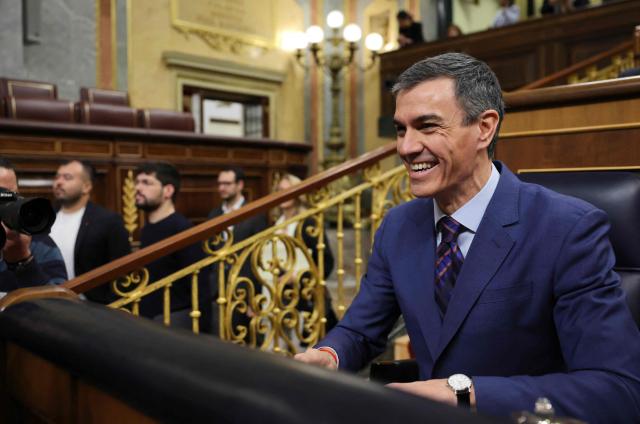 Spain's Prime minister Pedro Sanchez reacts before addressing parliament over the war in the Middle East at the congress in Madrid on March 25, 2026. Spanish Prime Minister Pedro Sanchez warned that the Middle East war presented a "far worse" scenario than the invasion of Iraq in 2003. (Photo by Thomas COEX / AFP)