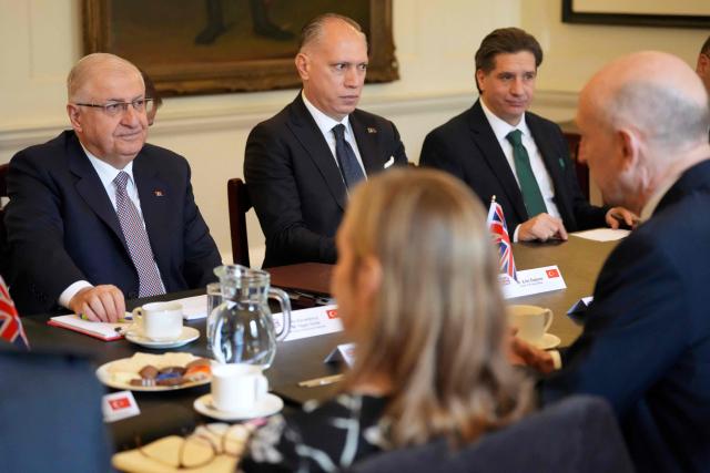 Britain's Defence Secretary John Healey (front R) sits down for talks with Turkey's Defence Minister Yasar Guler (L) in central London on March 25, 2026. (Photo by Kirsty Wigglesworth / POOL / AFP)