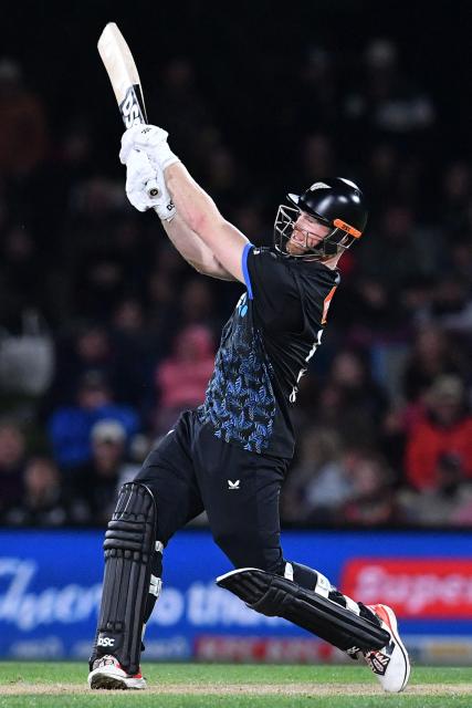 New Zealand's James Neesham bats during the fifth Twenty20 international cricket match between New Zealand and South Africa at Hagley Oval in Christchurch on March 25, 2026. (Photo by Sanka Vidanagama / AFP)