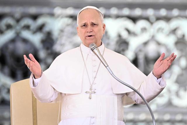 Pope Leo XIV addresses the crowd during the weekly general audience at St Peter's Square in The Vatican on March 25, 2026. (Photo by Filippo MONTEFORTE / AFP)