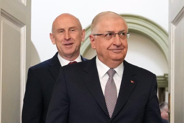 Britain's Defence Secretary John Healey (L) welcomes Turkey's Defence Minister Yasar Guler (R) for a meeting in central London on March 25, 2026. (Photo by Kirsty Wigglesworth / POOL / AFP)