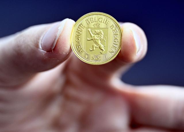 This photograph shows a 75 euro coin during the presentation of the 'Belga Gold', a Belgian investment coin, in Brussels on March 25, 2026. (Photo by ERIC LALMAND / Belga / AFP) / Belgium OUT