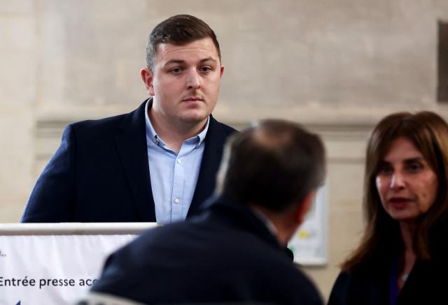 (FILES) Irish rugby player Denis Coulson (L), who is accused of gang rape, talks with his lawyer Corinne Dreyfus-Schmidt (R) before his trial at the Bordeaux courthouse, in Bordeaux south-western France, on December 2, 2024. Three former Grenoble rugby players, convicted at first instance for the rape of a student following a Top 14 match in Bordeaux in 2017, will face a closed-door trial from March 25, 2026 at the Angouleme Assize Court of Appeal. In December 2024, nearly eight years after the incident, Frenchman Loick Jammes and Irishman Denis Coulson were sentenced to 14 years imprisonment, and New Zealander Rory Grice to 12 years, for "gang rape". (Photo by ROMAIN PERROCHEAU / AFP)