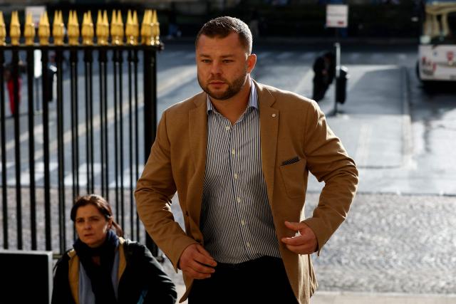 (FILES) French rugby player Loick Jammes, who is accused of gang rape, arrives for his trial at the Bordeaux courthouse, in Bordeaux south-western France, on December 2, 2024. Three former Grenoble rugby players, convicted at first instance for the rape of a student following a Top 14 match in Bordeaux in 2017, will face a closed-door trial from March 25, 2026 at the Angouleme Assize Court of Appeal. In December 2024, nearly eight years after the incident, Frenchman Loick Jammes and Irishman Denis Coulson were sentenced to 14 years imprisonment, and New Zealander Rory Grice to 12 years, for "gang rape". (Photo by ROMAIN PERROCHEAU / AFP)