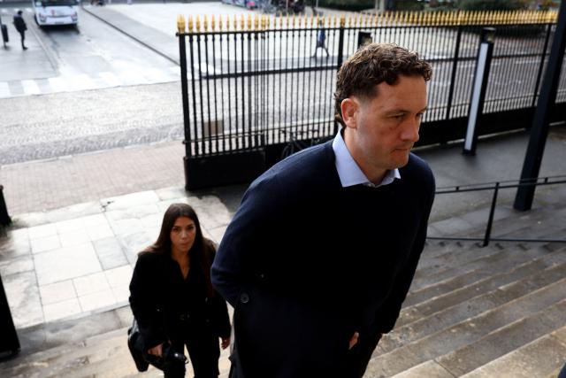 (FILES) New Zealander rugby player Rory Grice (R), who is accused of gang rape, arrives for his trial at the Bordeaux courthouse, in Bordeaux south-western France, on December 2, 2024. Three former Grenoble rugby players, convicted at first instance for the rape of a student following a Top 14 match in Bordeaux in 2017, will face a closed-door trial from March 25, 2026 at the Angouleme Assize Court of Appeal. In December 2024, nearly eight years after the incident, Frenchman Loick Jammes and Irishman Denis Coulson were sentenced to 14 years imprisonment, and New Zealander Rory Grice to 12 years, for "gang rape". (Photo by ROMAIN PERROCHEAU / AFP)
