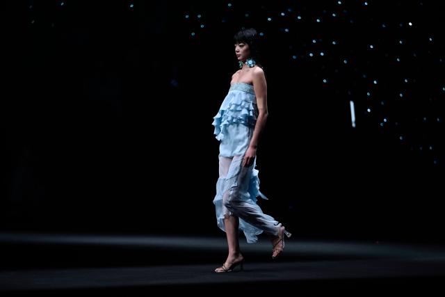A model displays a creation from Nunu Nono by En Zhang during the China Fashion Week in Beijing on March 25, 2026. (Photo by WANG Zhao / AFP)