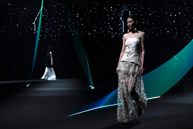 A model displays a creation from Nunu Nono by En Zhang during the China Fashion Week in Beijing on March 25, 2026. (Photo by WANG Zhao / AFP)