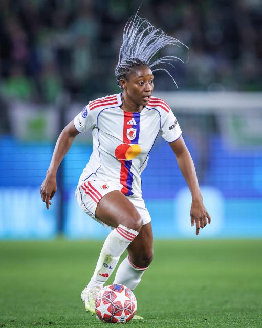 Lyon's French forward #11 Kadidiatou Diani plays the ball during the UEFA Women's Champions League Quarter final First Leg football match VfL Wolfsburg v Olympique Lyonnais (OL) in Wolfsburg, northern Germany, on March 24, 2026. (Photo by RONNY HARTMANN / AFP)