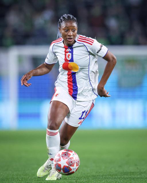 Lyon's French forward #11 Kadidiatou Diani plays the ball during the UEFA Women's Champions League Quarter final First Leg football match VfL Wolfsburg v Olympique Lyonnais (OL) in Wolfsburg, northern Germany, on March 24, 2026. (Photo by RONNY HARTMANN / AFP)