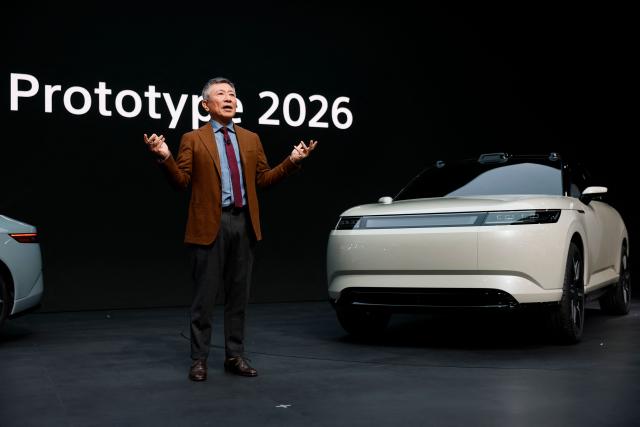 (FILES) CEO of Sony Honda Mobility Yasuhide Mizuno speaks beside the Afeela Prototype 2026 during a Sony Honda Mobility news conference ahead of the annual Consumer Electronics Show in Las Vegas, Nevada, on January 5, 2026. Honda and Sony said March 25, 2026 they will put their electric-vehicle project on hold as they assess its future in a changing global market. (Photo by Caroline Brehman / AFP)