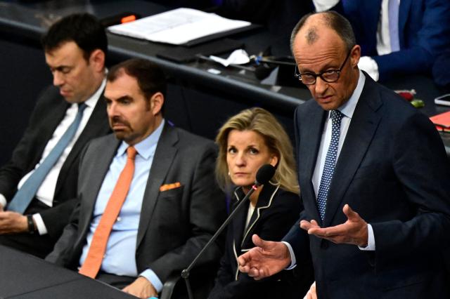 German Chancellor Friedrich Merz answers questions from parliamentarians to the government during a question time at the Bundestag (lower house of parliament) in Berlin, on March 25, 2026. (Photo by John MACDOUGALL / AFP)