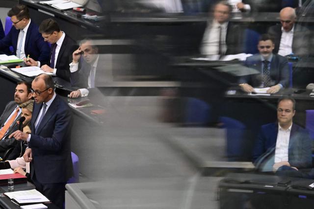 German Chancellor Friedrich Merz answers questions from parliamentarians to the government during a question time at the Bundestag (lower house of parliament) in Berlin, on March 25, 2026. (Photo by John MACDOUGALL / AFP)