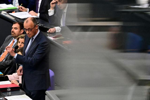 German Chancellor Friedrich Merz answers questions from parliamentarians to the government during a question time at the Bundestag (lower house of parliament) in Berlin, on March 25, 2026. (Photo by John MACDOUGALL / AFP)
