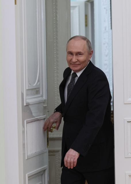 Russian President Vladimir Putin enters a hall for a meeting with Vietnamese Prime Minister at the Kremlin in Moscow on March 25, 2026. (Photo by MAXIM SHIPENKOV / POOL / AFP)