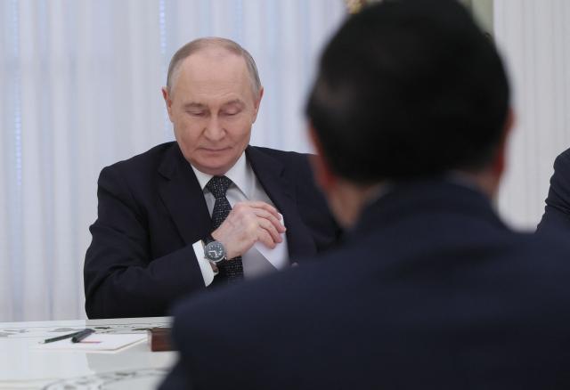 Russian President Vladimir Putin meets with Vietnamese Prime Minister at the Kremlin in Moscow on March 25, 2026. (Photo by MAXIM SHIPENKOV / POOL / AFP)