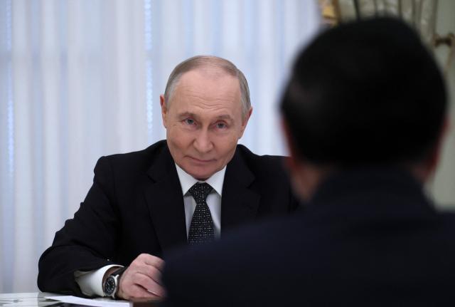 Russian President Vladimir Putin meets with Vietnamese Prime Minister at the Kremlin in Moscow on March 25, 2026. (Photo by MAXIM SHIPENKOV / POOL / AFP)