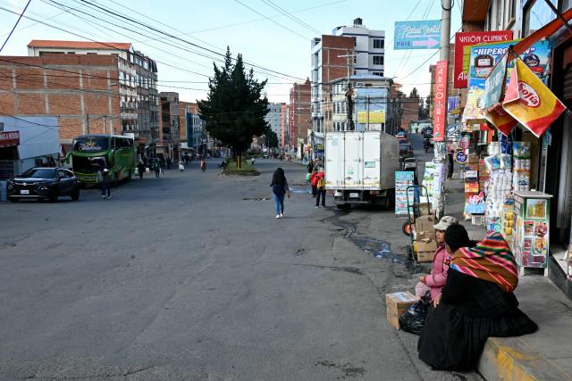 View of an empty street during a transport workers strike over the quality of diesel in La Paz, on March 25, 2026. (Photo by AIZAR RALDES / AFP)