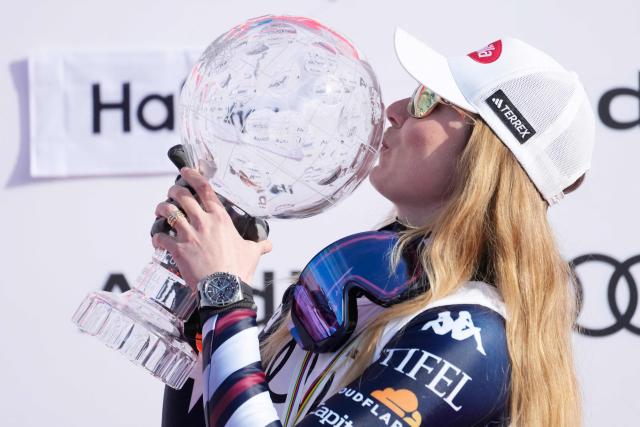 US' Mikaela Shiffrin celebrates on the podium for the 2025/2026 Women's Giant Slalom Cup in Hafjell on March 25, 2026. Mikaela Shiffrin won the overall World Cup title for the sixth time in her career, equaling the women’s record set by Annemarie Moser-Prцll in the 1970s. (Photo by Cornelius Poppe / NTB / AFP) / Norway OUT