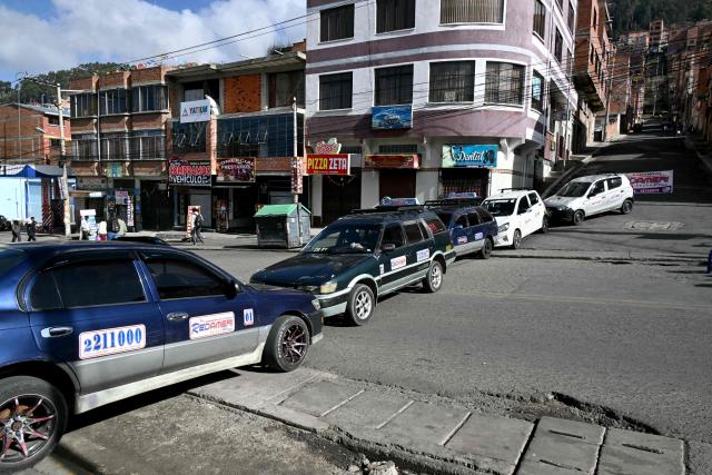 Members of the transport workers union block a street during a strike over the quality of diesel in La Paz, on March 25, 2026. (Photo by AIZAR RALDES / AFP)