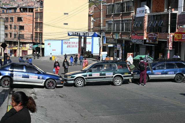 Members of the transport workers union block a street during a strike over the quality of diesel in La Paz, on March 25, 2026. (Photo by AIZAR RALDES / AFP)