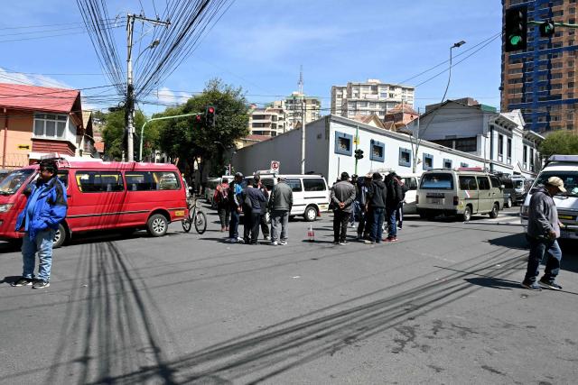 Members of the transport workers union block a street during a strike over the quality of diesel in La Paz, on March 25, 2026. (Photo by AIZAR RALDES / AFP)