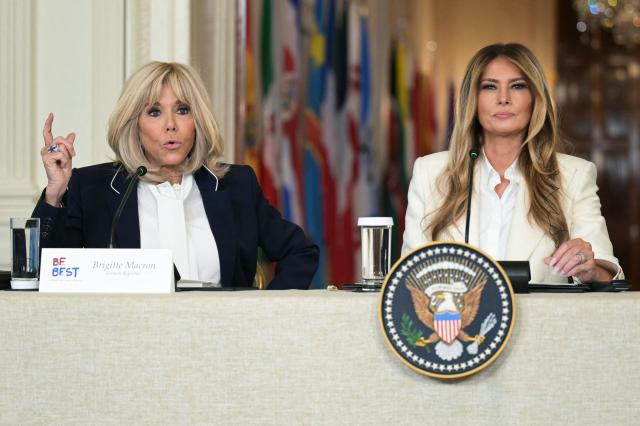 US First Lady Melania (R) listens as French first lady Brigitte Macron (L) speaks during the Fostering the Future Together Global Coalition Summit in the East Room of the White House in Washington, DC, on March 25, 2026. (Photo by Oliver Contreras / AFP)