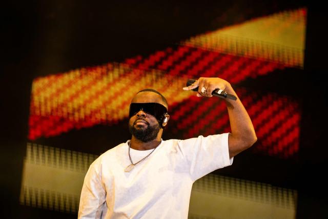 (FILES) Congolese singer, rapper, and singer-songwriter GIMS, formerly known as Maоtre Gims performs at the Golden Coast rap festival in Corcelles-les-Monts near Dijon, central eastern France, on September 6, 2025. Rapper Gims is in police custody in an organized money laundering case announced the organized crime prosecutor’s office on March 25, 2026. (Photo by ARNAUD FINISTRE / AFP)