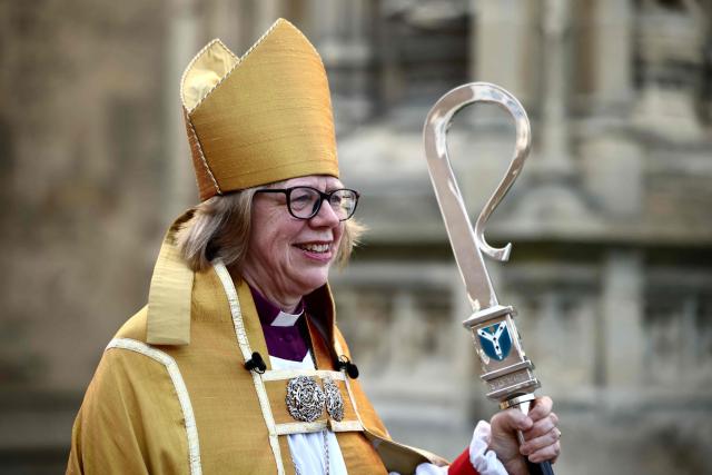 Archbishop of Canterbury Sarah Mullally smiles as she departs following her installation ceremony at Canterbury Cathedral, south-east England on March 25, 2026. The Church of England became Britain's state establishment church following King Henry VIII's split from the Roman Catholic Church in the 1530s. The British monarch is its supreme governor, while the Archbishop of Canterbury is seen as the spiritual leader of Anglicans worldwide. (Photo by Henry NICHOLLS / AFP)