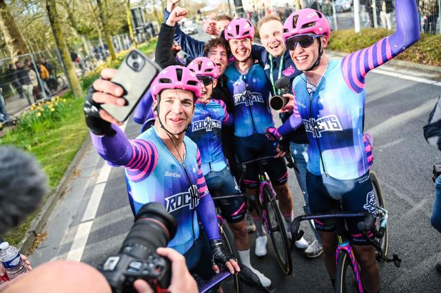 Netherlands' Dylan Groenewegen of Unibet Rose Rockets (L) takes a selfie with teammates  after winning the 'Ronde van Brugge' men's elite one-day cycling race, 202,9 km from and to Bruges on March 25, 2026. (Photo by ELIAS ROM / Belga / AFP) / Belgium OUT