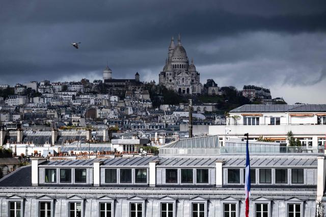 This photograph shows the Sacre Coeur Basilica on Montmartre hill before a storm in Paris on March 25, 2026. (Photo by Blanca CRUZ / AFP)