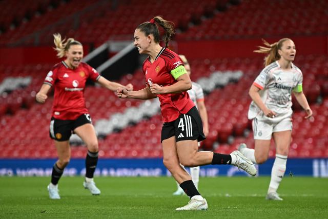 Manchester United's English defender #04 Maya Le Tissier celebrates after scoring Manchester United's first goal from the penalty spot during the UEFA Women's Champions League, Quarter Final first-leg football match between Manchester United and Bayern Munich at Old Trafford in Manchester, north west England, on March 25, 2025. (Photo by Paul ELLIS / AFP)