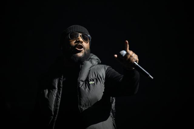 French rapper Lino performs on stage during a concert in tribute to French late rapper Werenoi at the Accor Arena in Paris on March 25, 2026. (Photo by JULIEN DE ROSA / AFP)