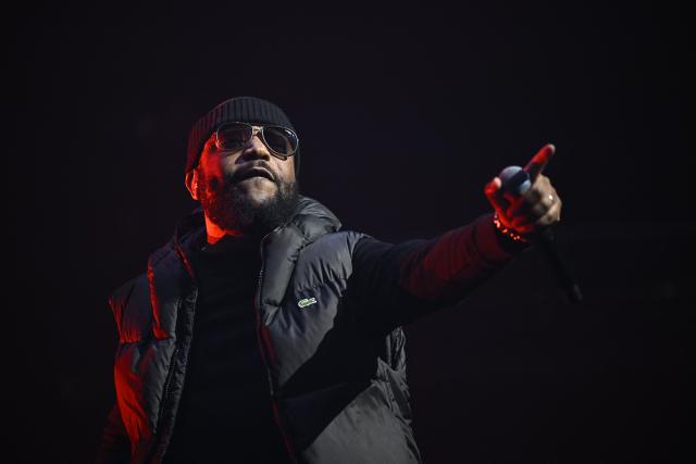 French rapper Lino performs on stage during a concert in tribute to French late rapper Werenoi at the Accor Arena in Paris on March 25, 2026. (Photo by JULIEN DE ROSA / AFP)
