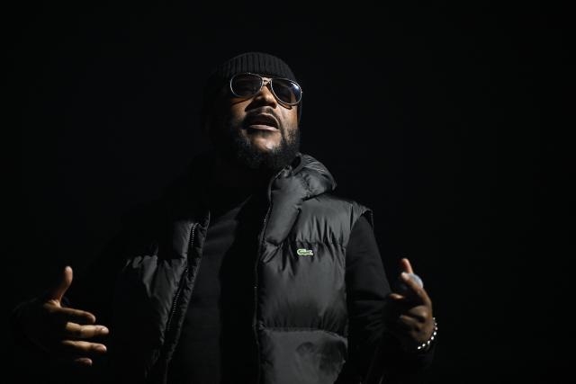 French rapper Lino performs on stage during a concert in tribute to French late rapper Werenoi at the Accor Arena in Paris on March 25, 2026. (Photo by JULIEN DE ROSA / AFP)