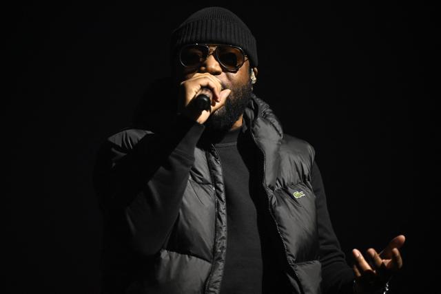 French rapper Lino performs on stage during a concert in tribute to French late rapper Werenoi at the Accor Arena in Paris on March 25, 2026. (Photo by JULIEN DE ROSA / AFP)
