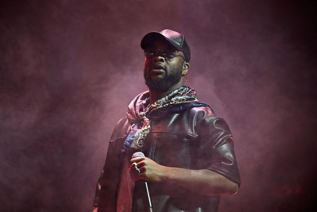 French rapper Dosseh performs on stage during a concert in tribute to French late rapper Werenoi at the Accor Arena in Paris on March 25, 2026. (Photo by JULIEN DE ROSA / AFP)