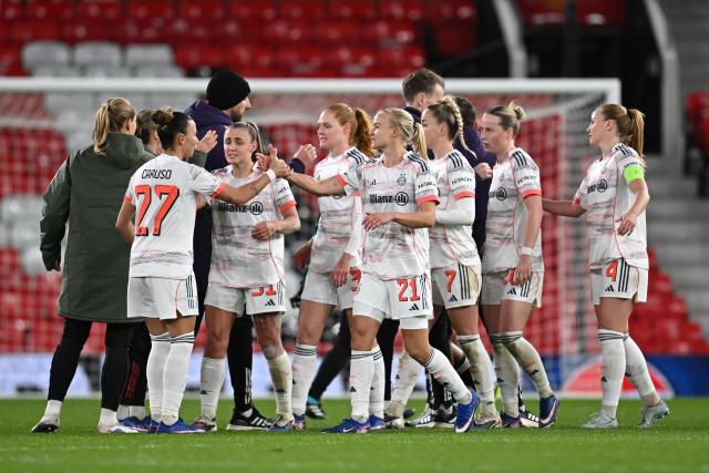 Bayern Munich's players celebrate their victory at the end of the UEFA Women's Champions League, Quarter Final first-leg football match between Manchester United and Bayern Munich at Old Trafford in Manchester, north west England, on March 25, 2025. (Photo by Paul ELLIS / AFP)