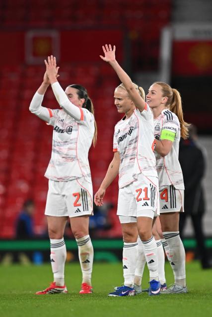 Bayern Munich's players acknowledge the crowd as they celebrate their victory at the end of the UEFA Women's Champions League, Quarter Final first-leg football match between Manchester United and Bayern Munich at Old Trafford in Manchester, north west England, on March 25, 2025. (Photo by Paul ELLIS / AFP)