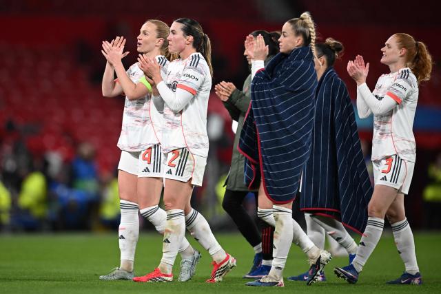 Bayern Munich's players celebrate their victory at the end of the UEFA Women's Champions League, Quarter Final first-leg football match between Manchester United and Bayern Munich at Old Trafford in Manchester, north west England, on March 25, 2025. (Photo by Paul ELLIS / AFP)